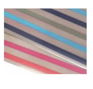 Features recycled rainbow striped PVC rectangular woven table placemats